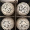 Overhead close-up of four Henselite Dreamline XG bowls inside their box